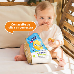 baby eating buckwheat crackers and fruit