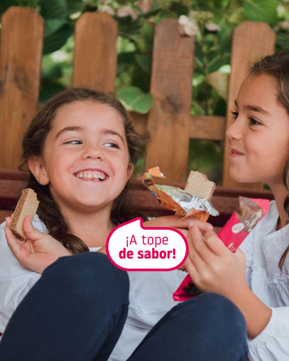 Girls in the park eating SMILEAT wafers with no added sugar