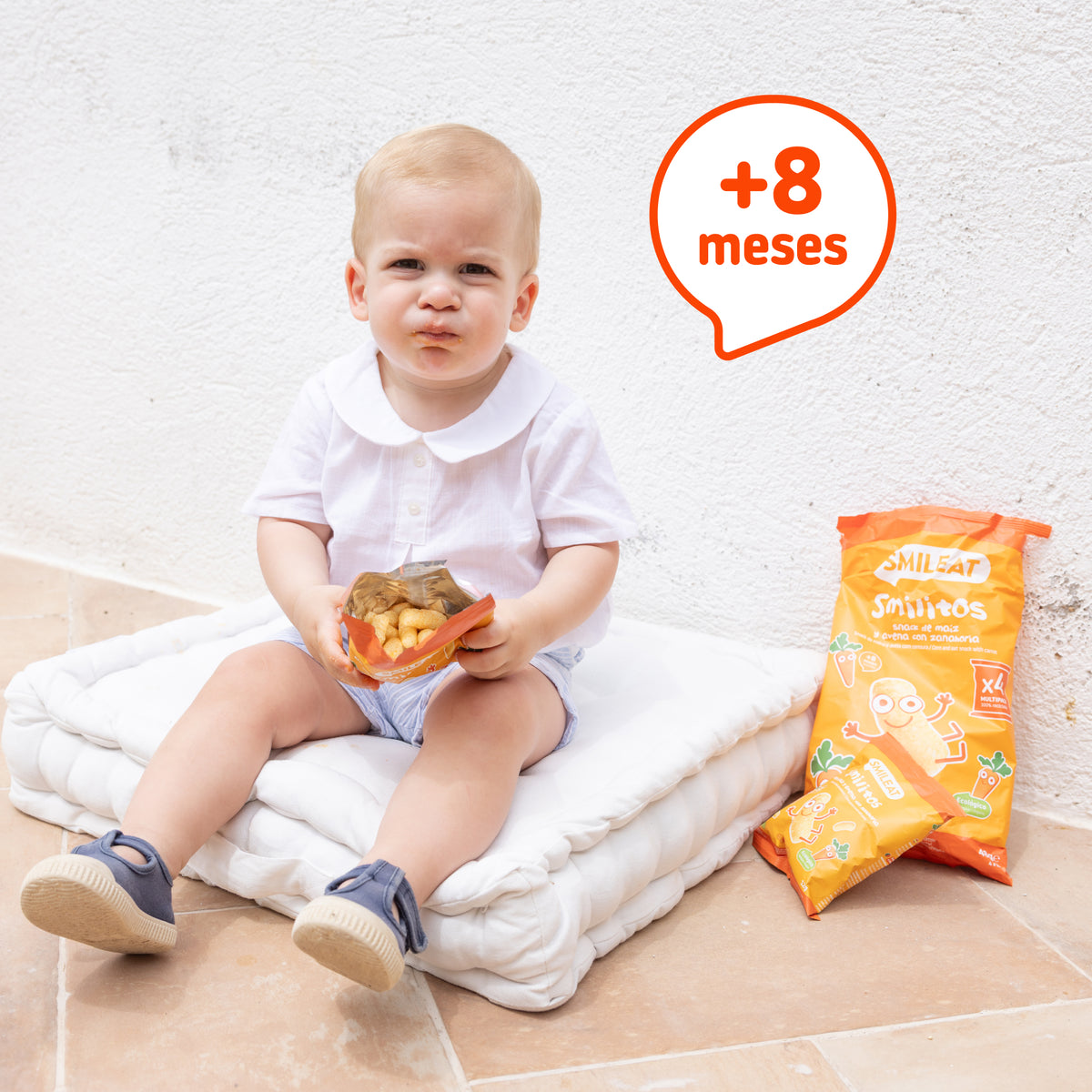 Child eating corn snack for 8-month-olds